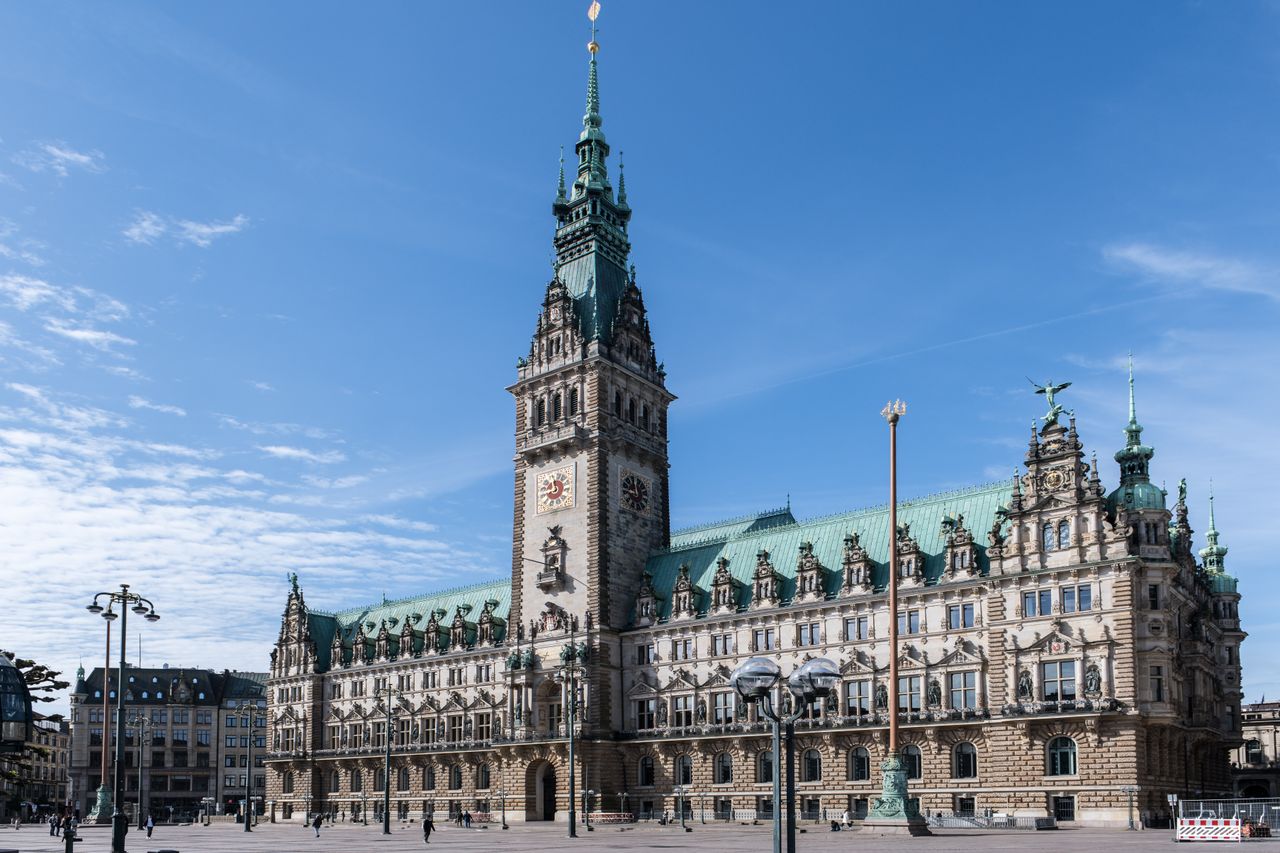 Hamburg Town Hall in Germany captured in daylight showcasing its historic architecture under a clear blue sky.