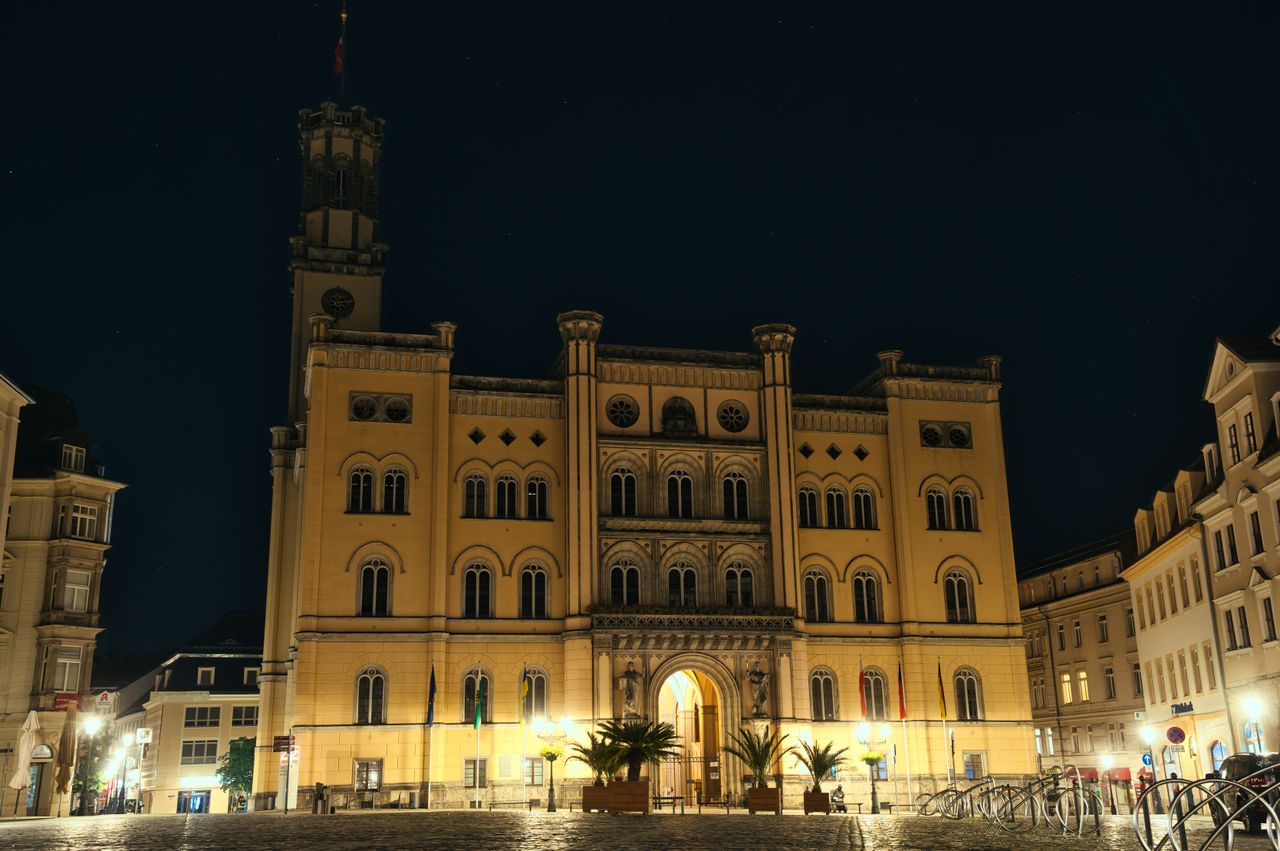 Stunning night view of the Zittau Town Hall in Saxony, Germany, beautifully illuminated.